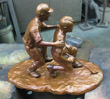 Father and Son Golfing Bronze Statue