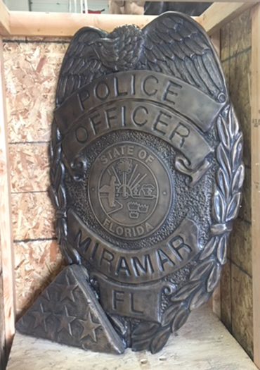 Police Officer Shield And Folded Flag Memorial Statue