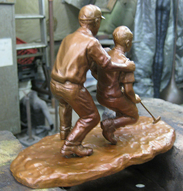 Son and Father Learning to Golf Statue